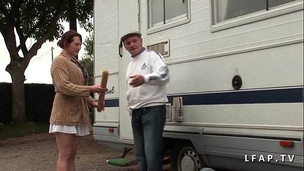 Serious redhead whore caught in double penetration in a gangbang with an old man