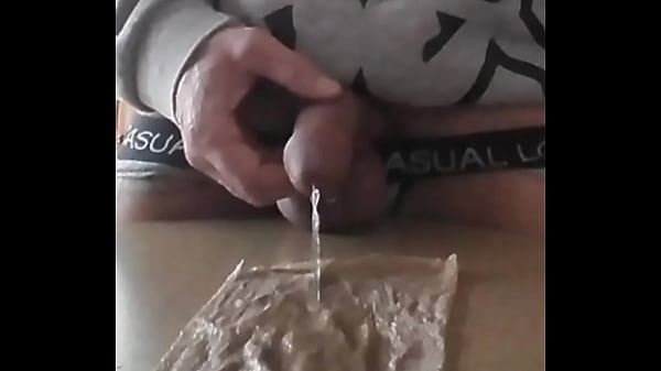 I piss and jerk off with my piss, my balls tied with a tie,